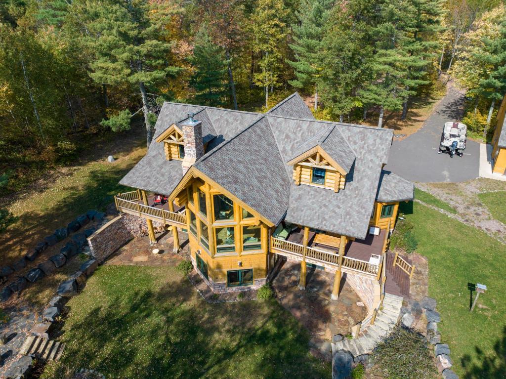 an overhead view of a house with a roof at Osprey Lake Cabin home in Hayward