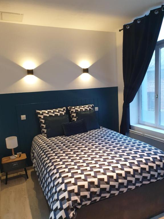 Ένα ή περισσότερα κρεβάτια σε δωμάτιο στο Résidence Bel'Air
