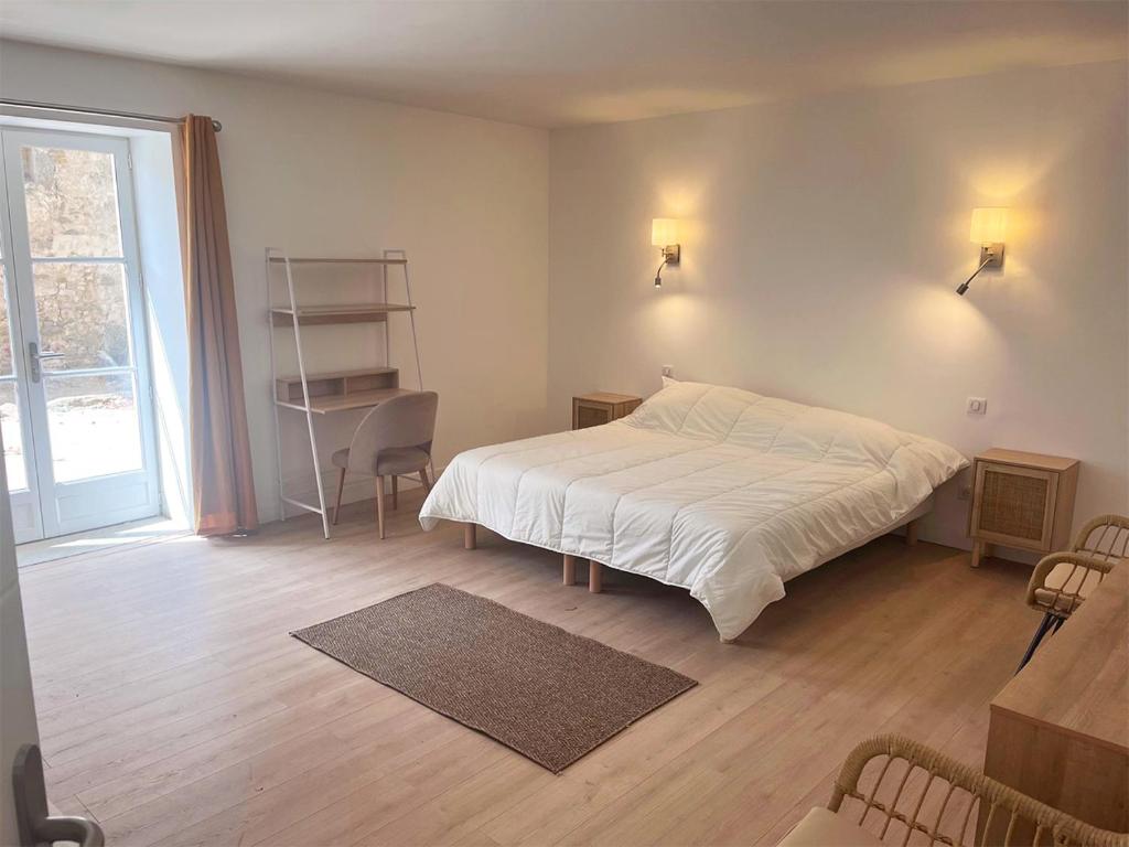 Postel nebo postele na pokoji v ubytování Domaine de Garille