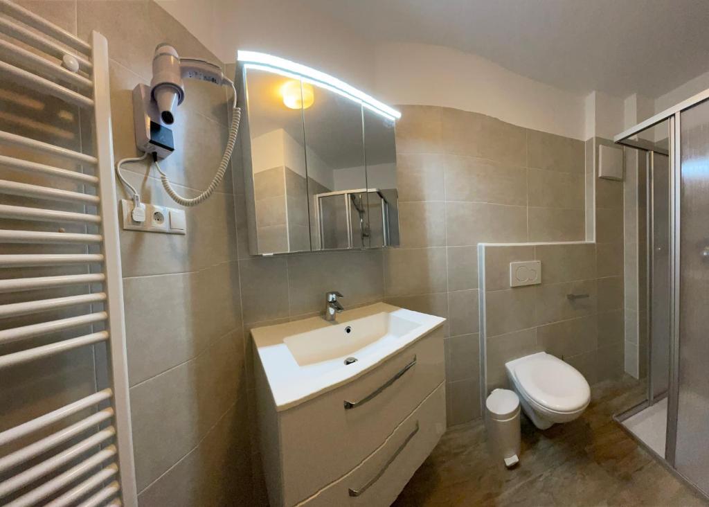 Koupelna v ubytování Hotel Mont Floris Obereggen