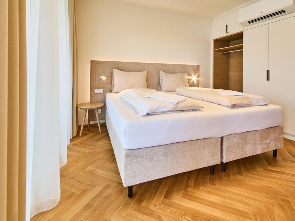 Postel nebo postele na pokoji v ubytování Hermitage Vital Hotel