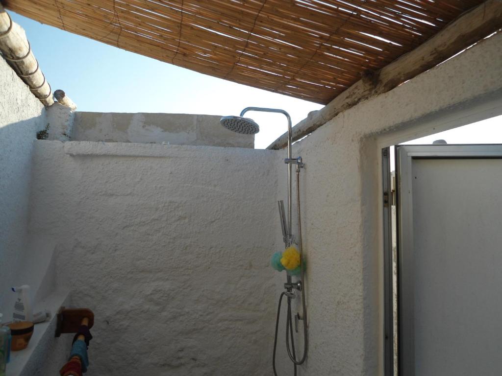 a bathroom with a shower in a wall at Ville Alba & Azzurra in Polignano a Mare