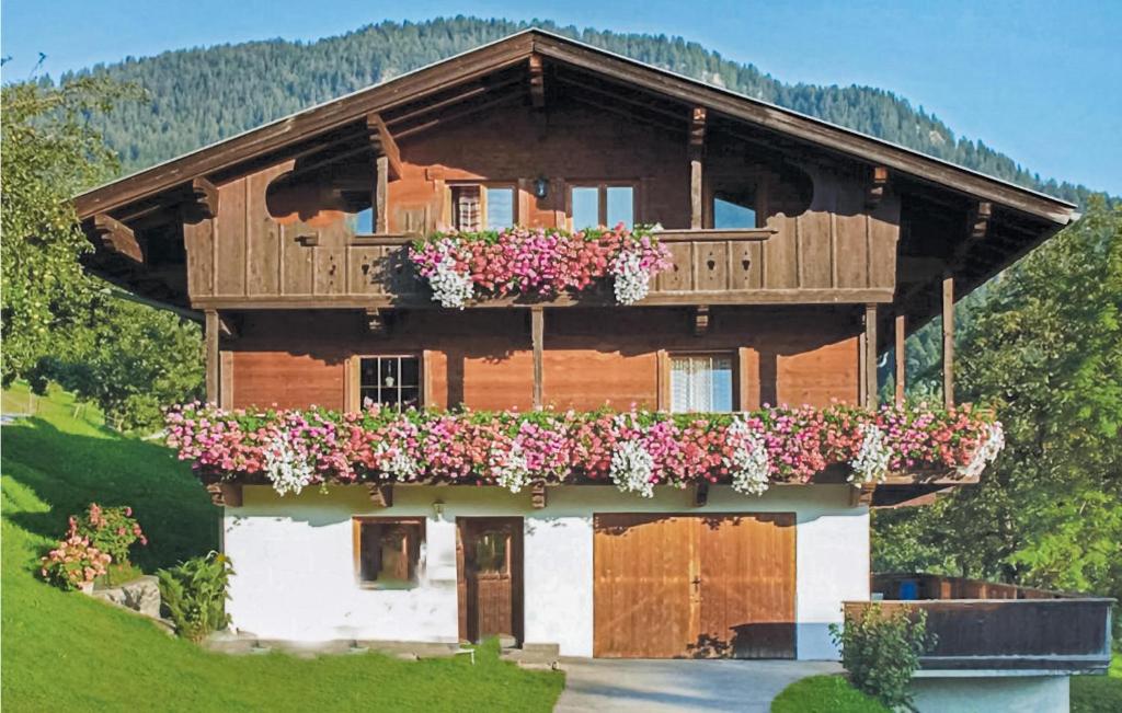 a house with flower boxes on the front of it at Lovely Apartment In Reith Im Alpbachtal With House A Mountain View in Brixlegg