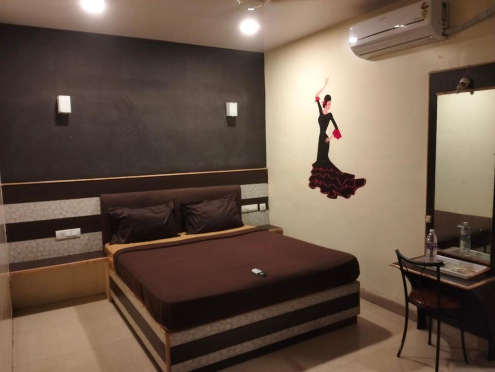 Postel nebo postele na pokoji v ubytování Madurai Grands Inn