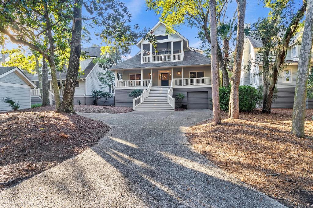 a house with a driveway in front of it at 7 Ocean Green in Kiawah Island