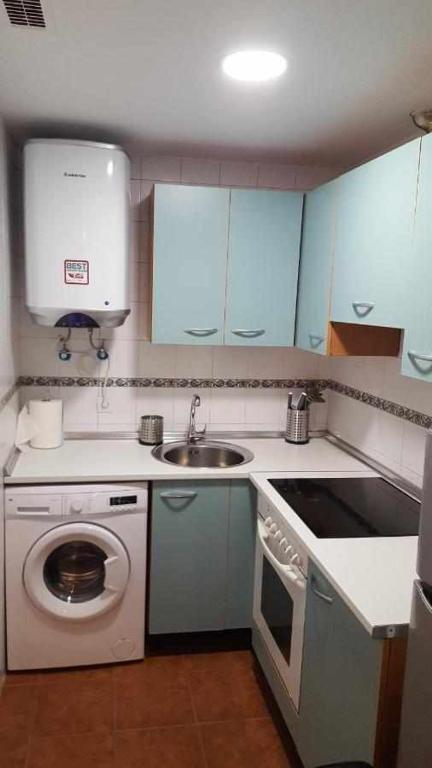 Kuchyň nebo kuchyňský kout v ubytování Apartamenticos Boggiero I