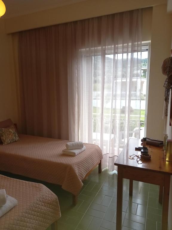 Postel nebo postele na pokoji v ubytování Natassa House 2