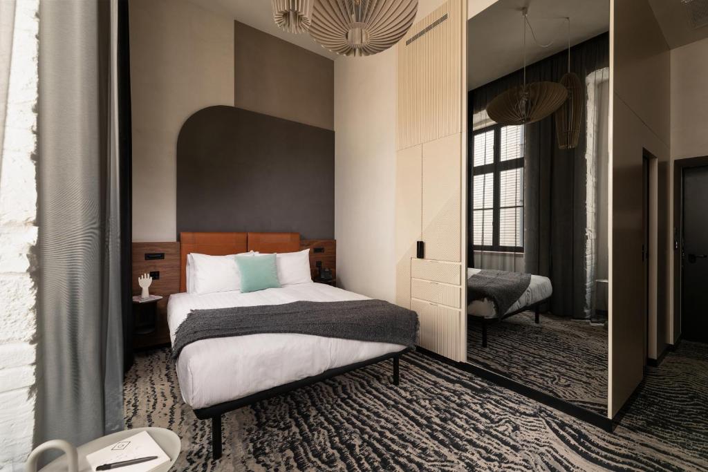 Voodi või voodid majutusasutuse Hotel GIN Budapest toas