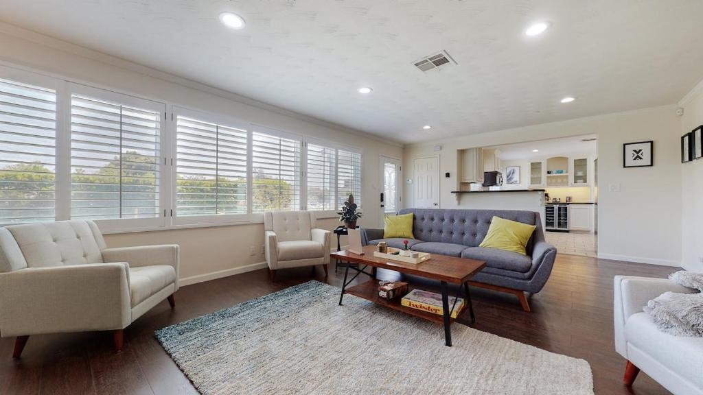 a living room with a couch and a table at Dazzling Westside 4 Br Home-minutes To The Beach in Los Angeles