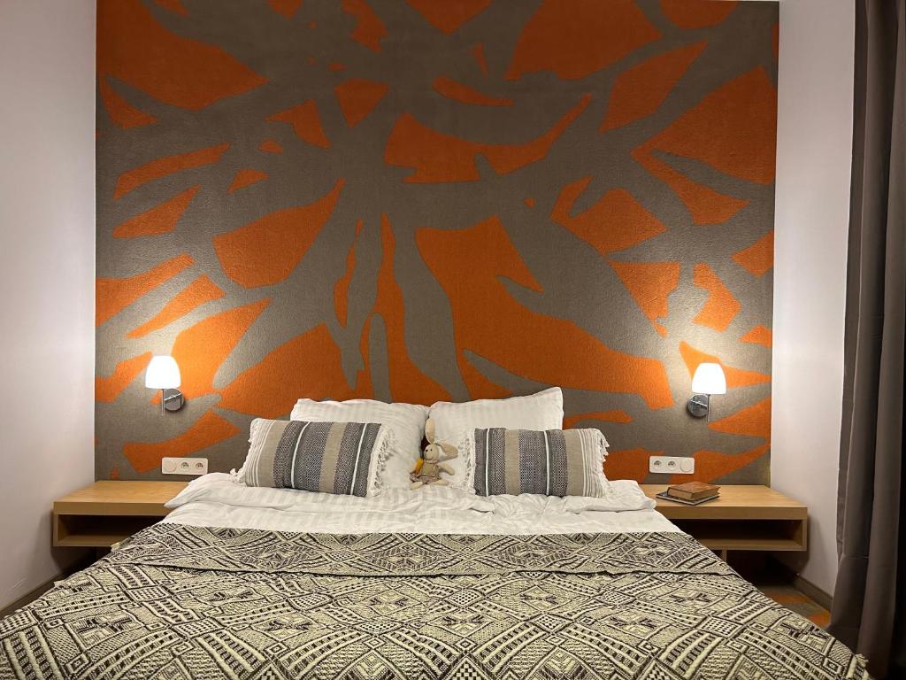 Un pat sau paturi într-o cameră la Hotel Eldorado
