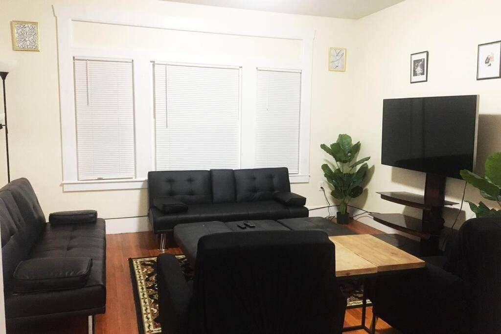 a living room with a couch and a table at Comfy 4 Bed 1 Bath w/ Wi-fi in College Area in Springfield
