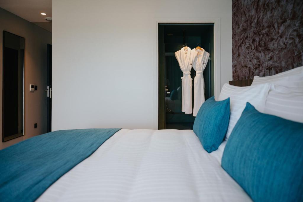Postel nebo postele na pokoji v ubytování Sable Bleu Boutique Hotel