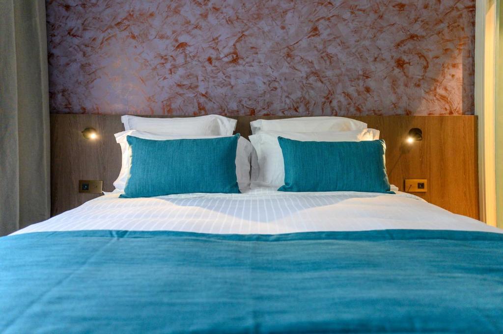 Postel nebo postele na pokoji v ubytování Sable Bleu Boutique Hotel