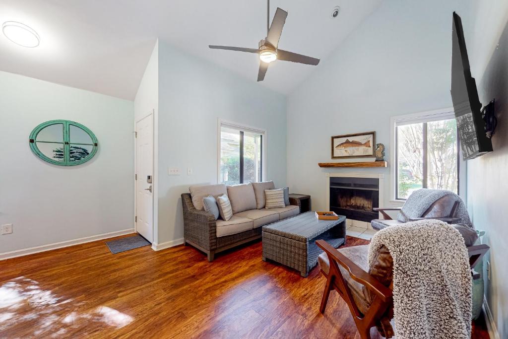 a living room with a couch and a fireplace at Maple Leaves - 30 Day Rental in Charleston