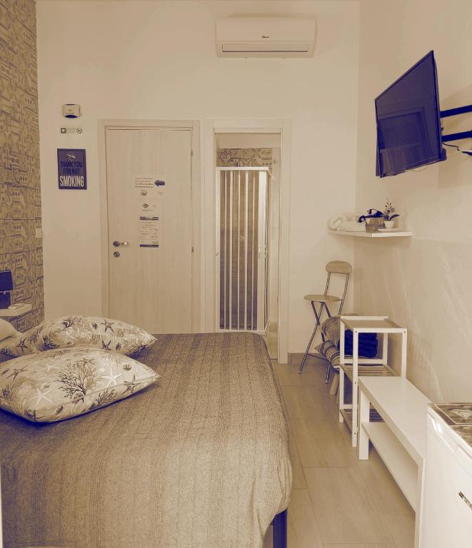 Televízia a/alebo spoločenská miestnosť v ubytovaní B&B Il Castello