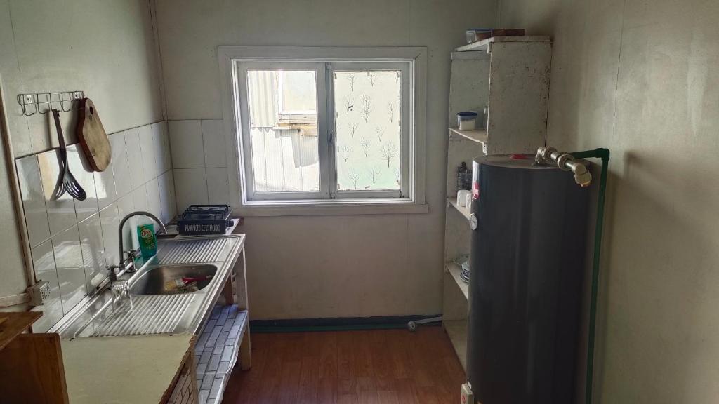 Köök või kööginurk majutusasutuses HOSTAL VALDIVIA