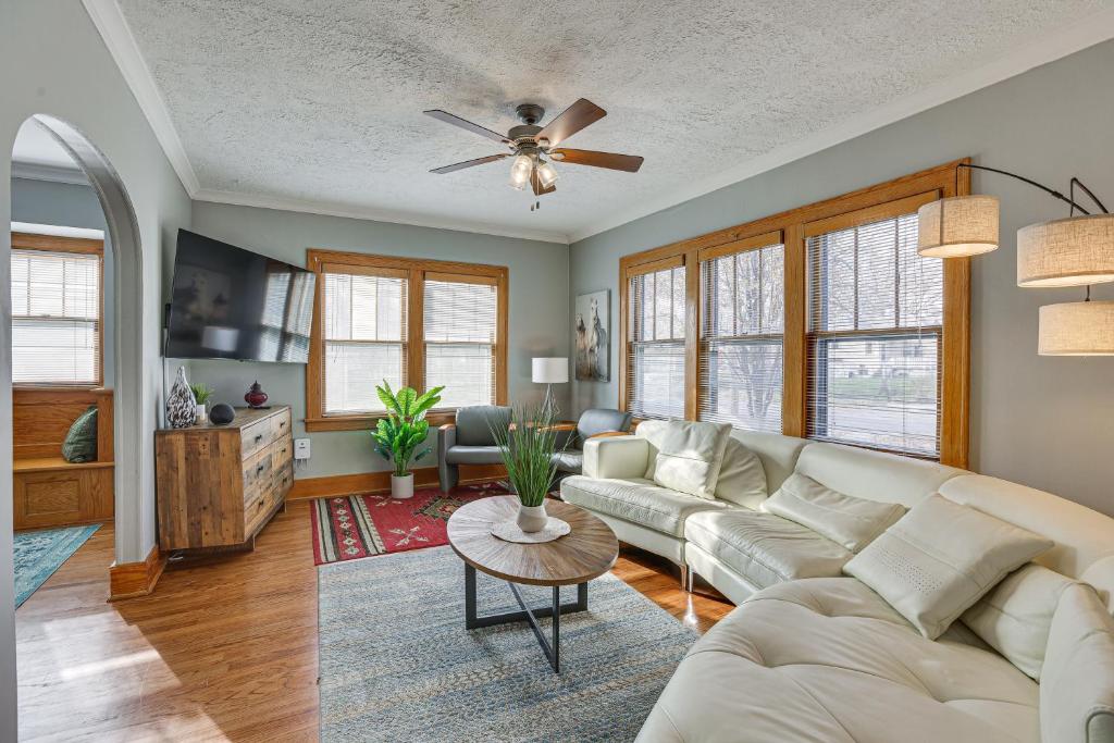 a living room with a couch and a table at Pet-Friendly Omaha Vacation Rental with Deck! in Omaha