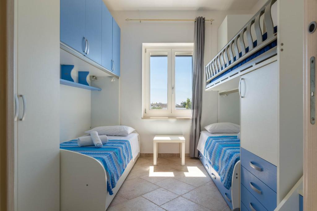 Кровать или кровати в номере Casa D'Amare