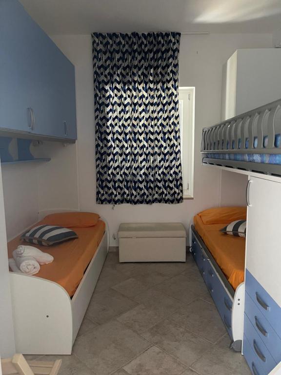 Кровать или кровати в номере Casa D'Amare