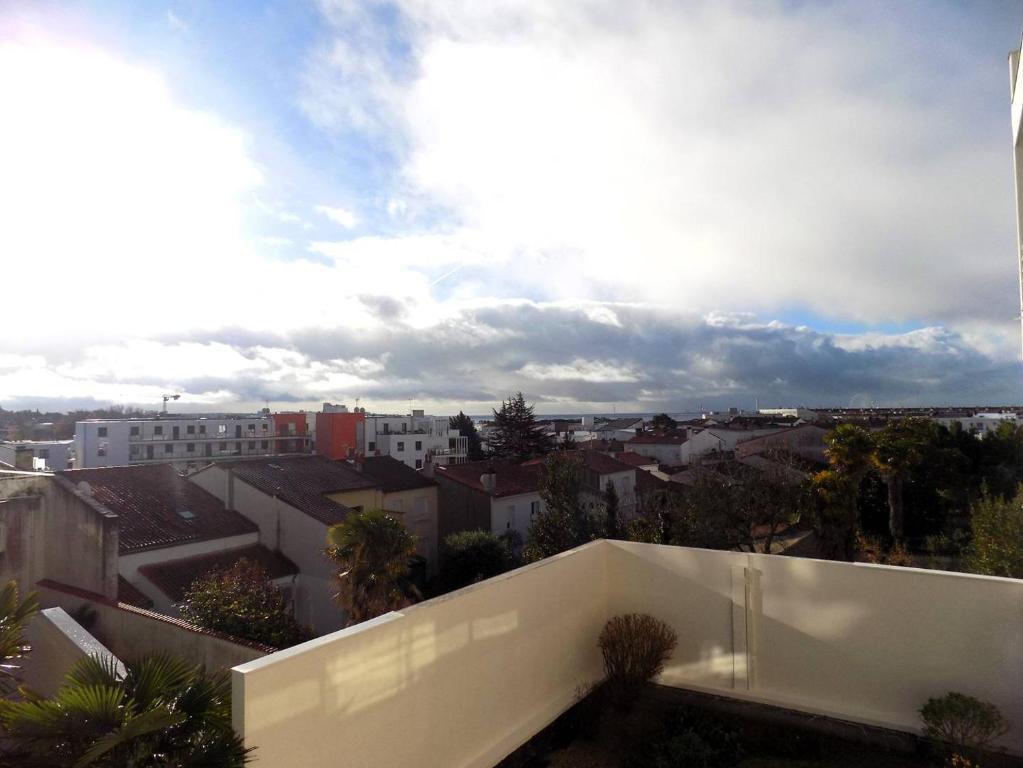 a view of a city from the roof of a building at Royan - Résidence VILLA BRACELLI - APPARTEMENT SPACIEUX - Centre-ville in Royan