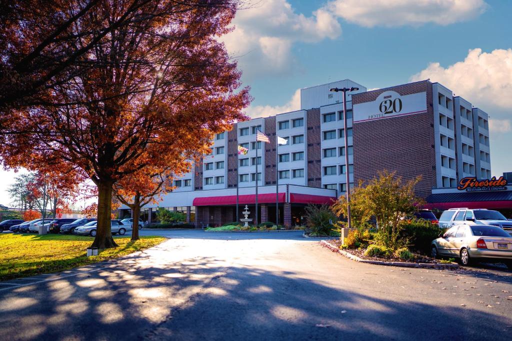 a large building with cars parked in a parking lot at Hotel 620 in Hagerstown