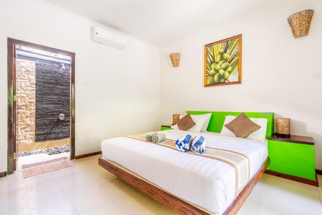 Postel nebo postele na pokoji v ubytování Senang Villa Gili Air