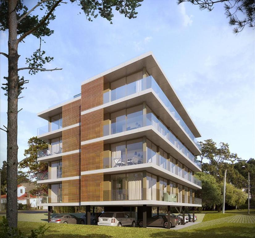 a rendering of a building with cars parked in front at Edificio Pinheiros in Punta del Este