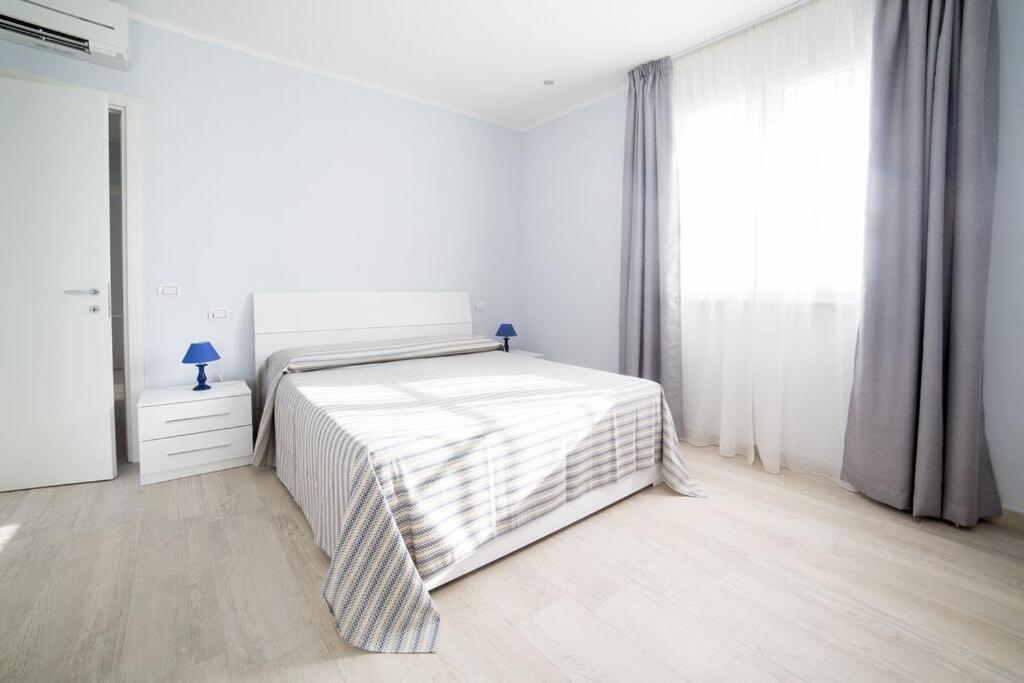 A bed or beds in a room at Home by Massi