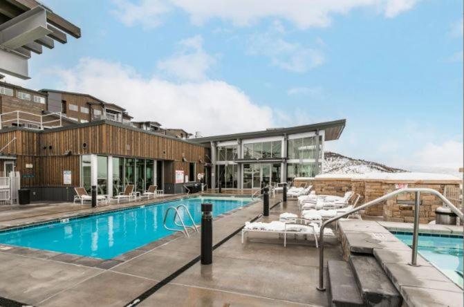 The swimming pool at or close to Apex Residence by All Seasons Resort Lodging