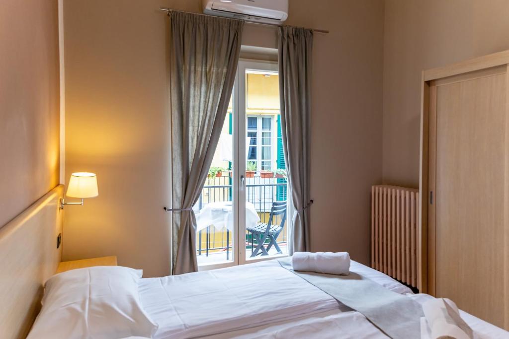 Postel nebo postele na pokoji v ubytování Hotel Novara