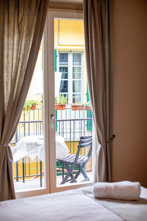 Postel nebo postele na pokoji v ubytování Hotel Novara