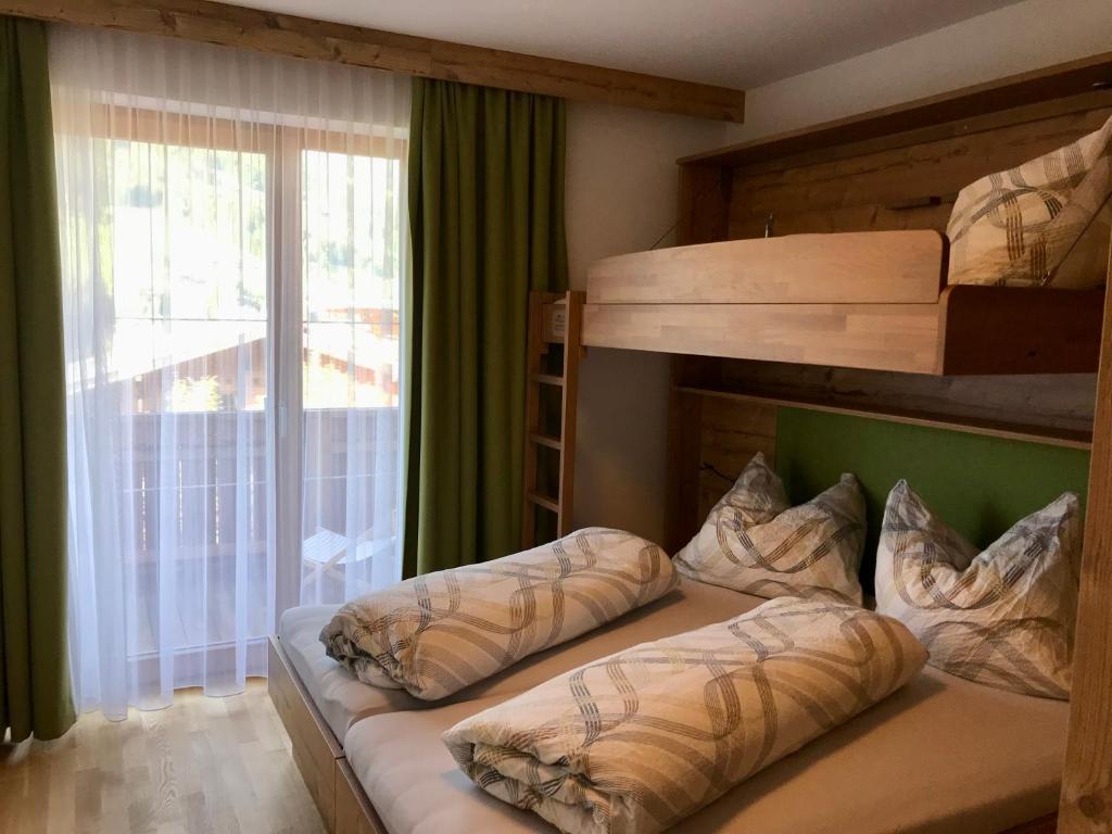 Posteľ alebo postele v izbe v ubytovaní Ferienwohnung Neubau