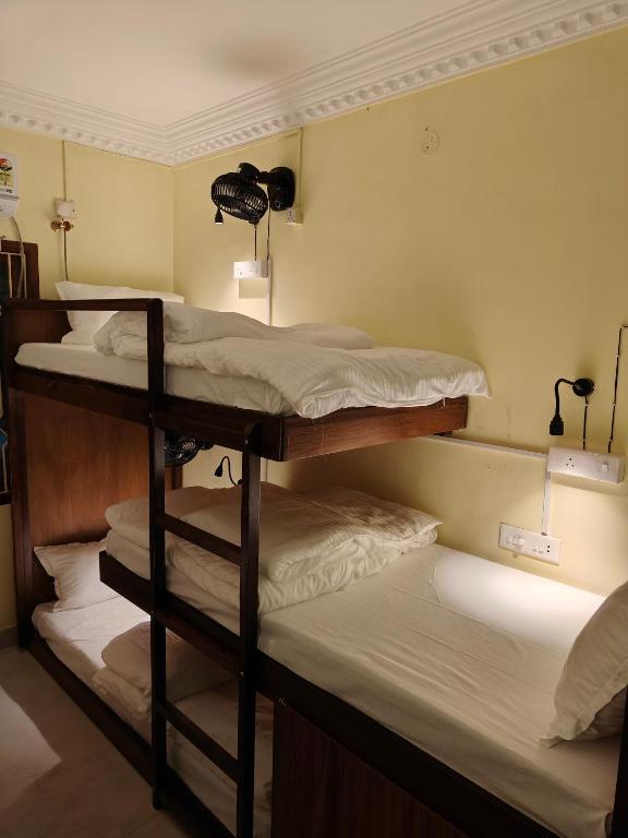 Voodi või voodid majutusasutuse Unpack Hostel toas