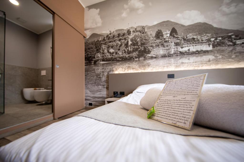 Postel nebo postele na pokoji v ubytování Hotel Novara