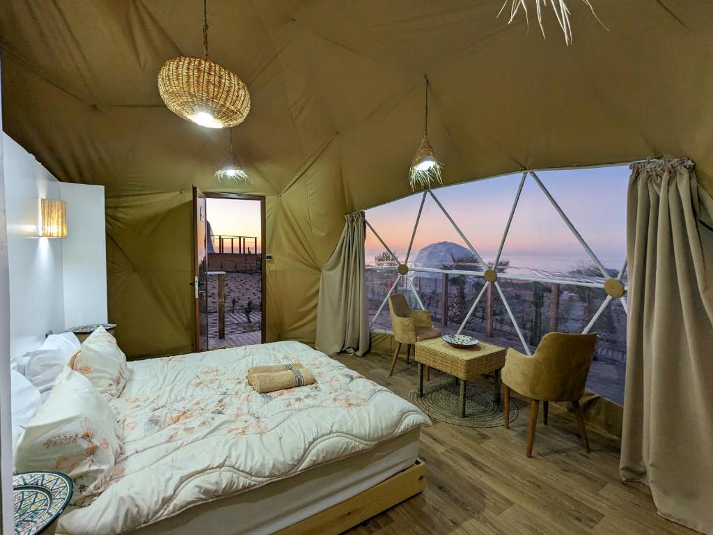 A bed or beds in a room at Timlalin Dome
