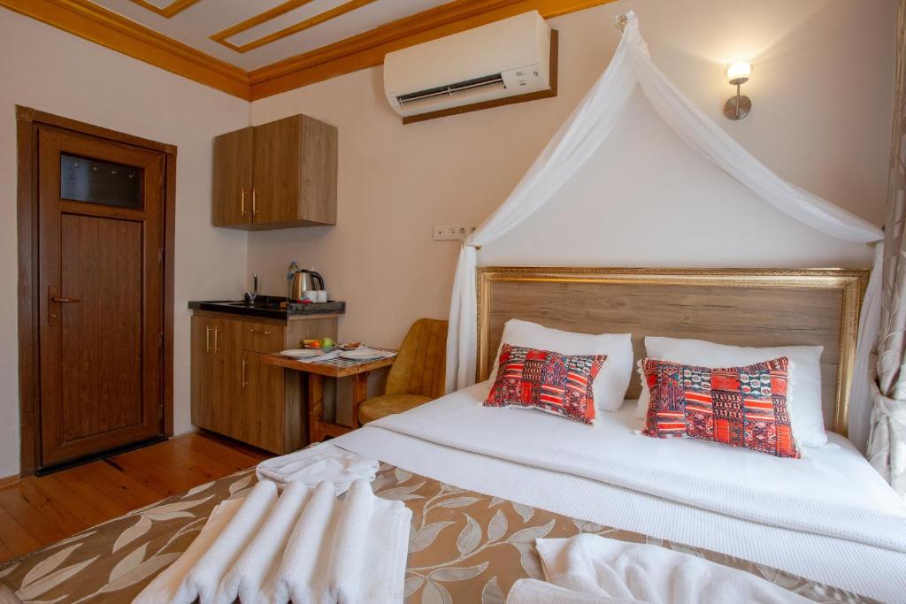 Postel nebo postele na pokoji v ubytování April Story Apart Hotel
