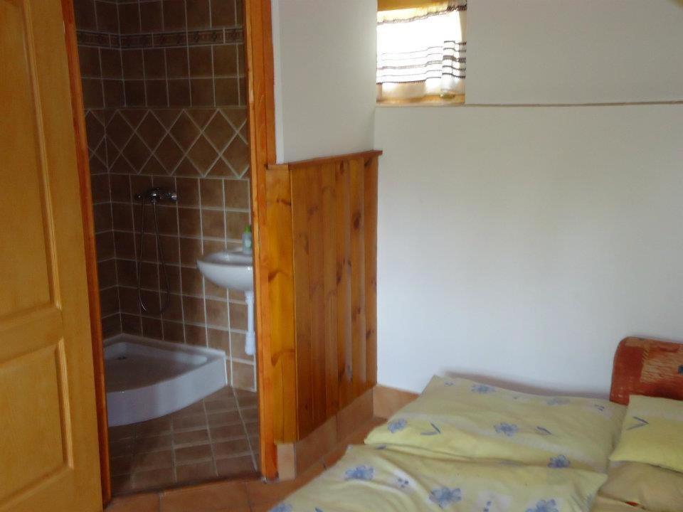 Postel nebo postele na pokoji v ubytování Cserhát Guesthouse