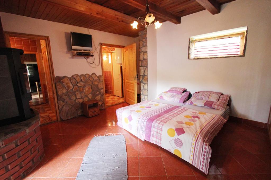 Postel nebo postele na pokoji v ubytování Cserhát Guesthouse