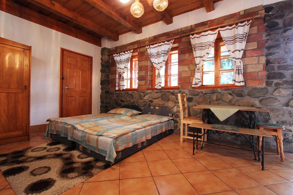 Postel nebo postele na pokoji v ubytování Cserhát Guesthouse