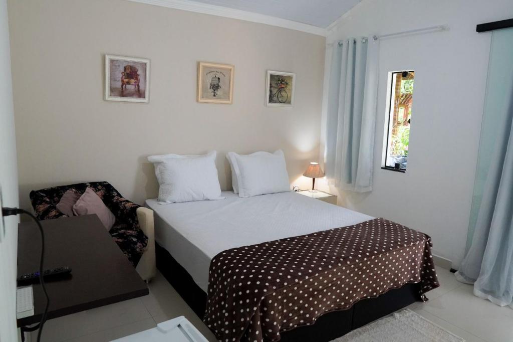 A bed or beds in a room at Refúgio da Montanha - Cascata - Lumiar