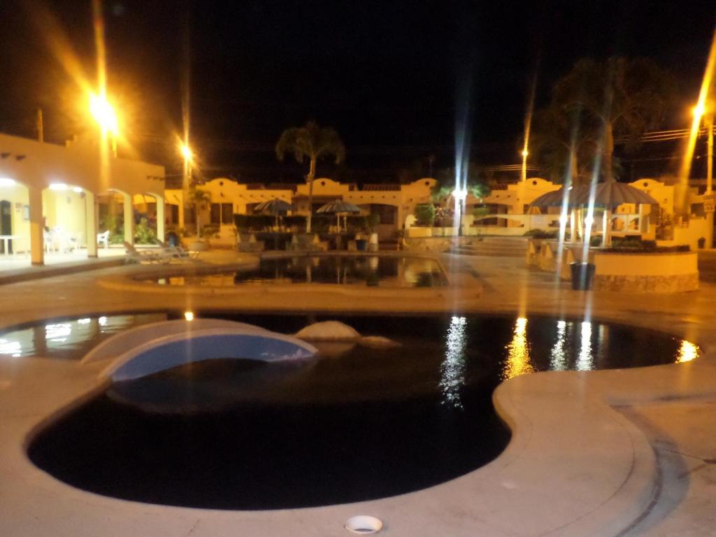 a fountain in the middle of a courtyard at night at Riveri Salinas V53 in Salinas