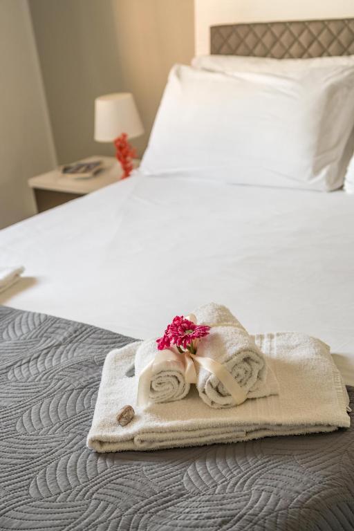 A bed or beds in a room at CapoSud - Appartamento Ancora