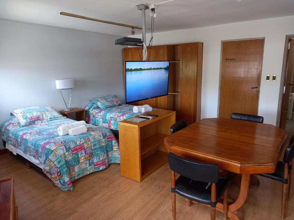 Ένα ή περισσότερα κρεβάτια σε δωμάτιο στο Vía Lavalle Suites 1