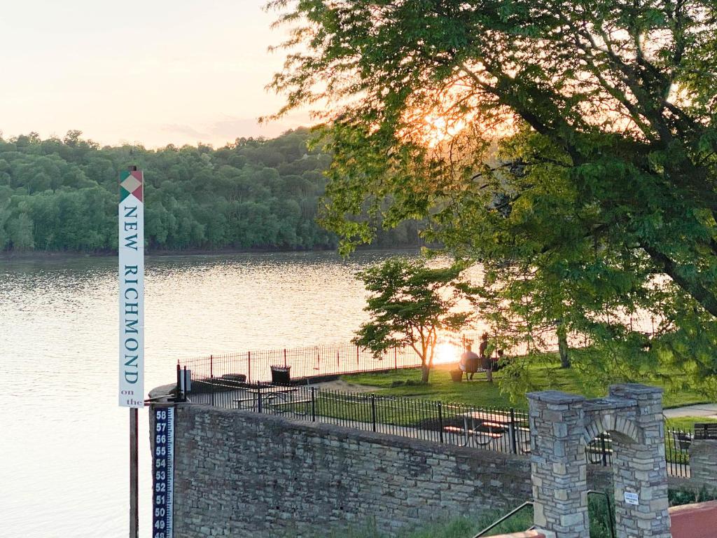 a sign on the side of a lake with at Historic New Richmond Ohio Riverfront Hotel in New Richmond