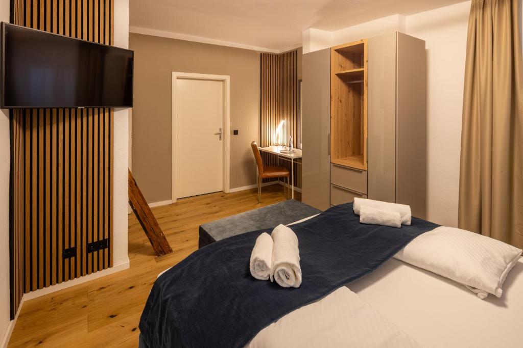 Postel nebo postele na pokoji v ubytování Hotel Schwanen