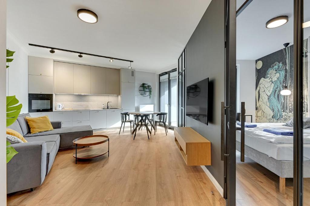 Televízia a/alebo spoločenská miestnosť v ubytovaní Apartamenty Portova Q4Apartments