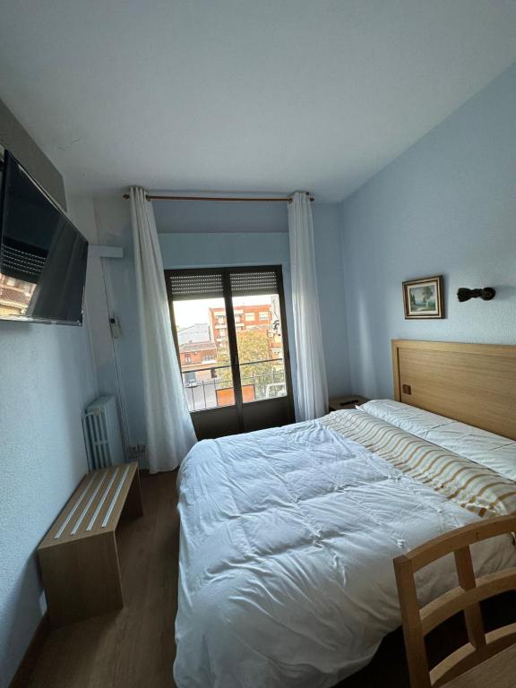 Postel nebo postele na pokoji v ubytování Hostal agripino y Restaurante asiático