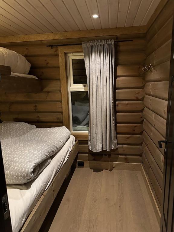 Postel nebo postele na pokoji v ubytování Årebjørnen - Sadelen