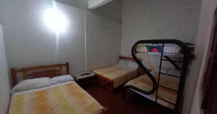 Postel nebo postele na pokoji v ubytování Hostal posada San jose
