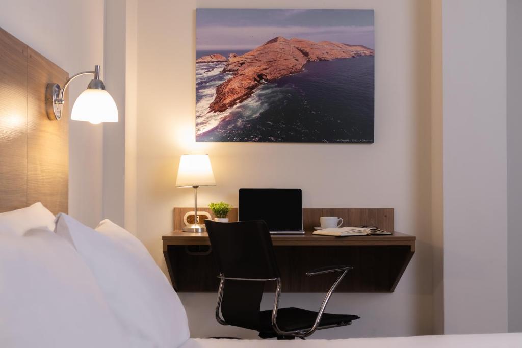 Postel nebo postele na pokoji v ubytování Hotel Alexander
